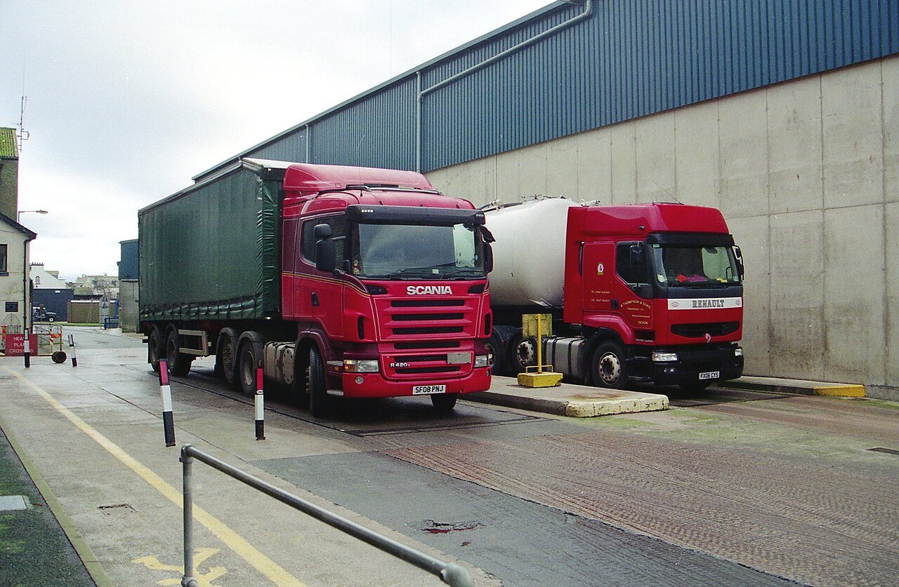 Curtain-side tractor units at a depot